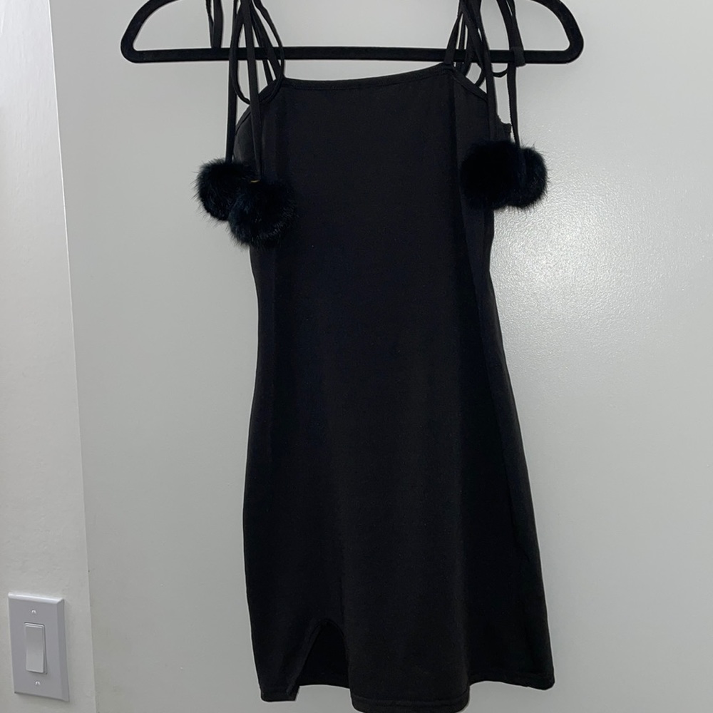 Black minidress with pompoms. Size S.